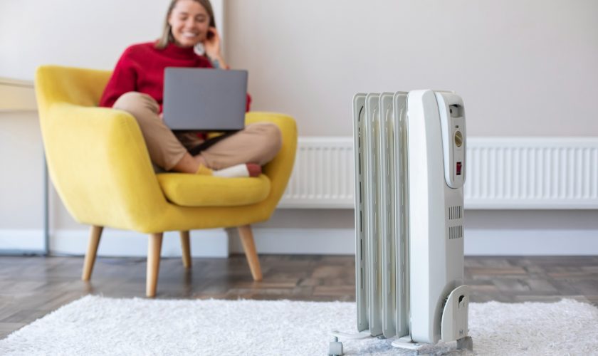 woman using portable ac at home